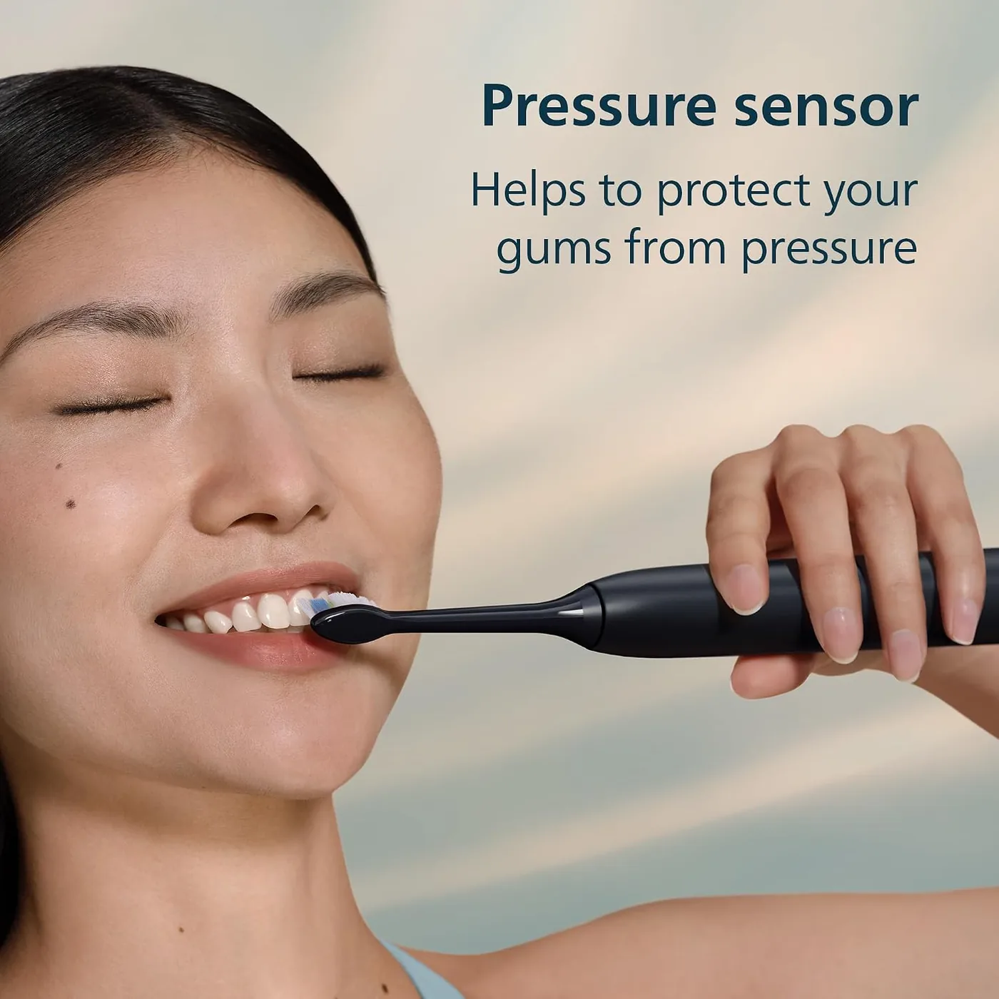 Person using the Philips Sonicare 5300 with the pressure alert shown in the manufacturer graphic