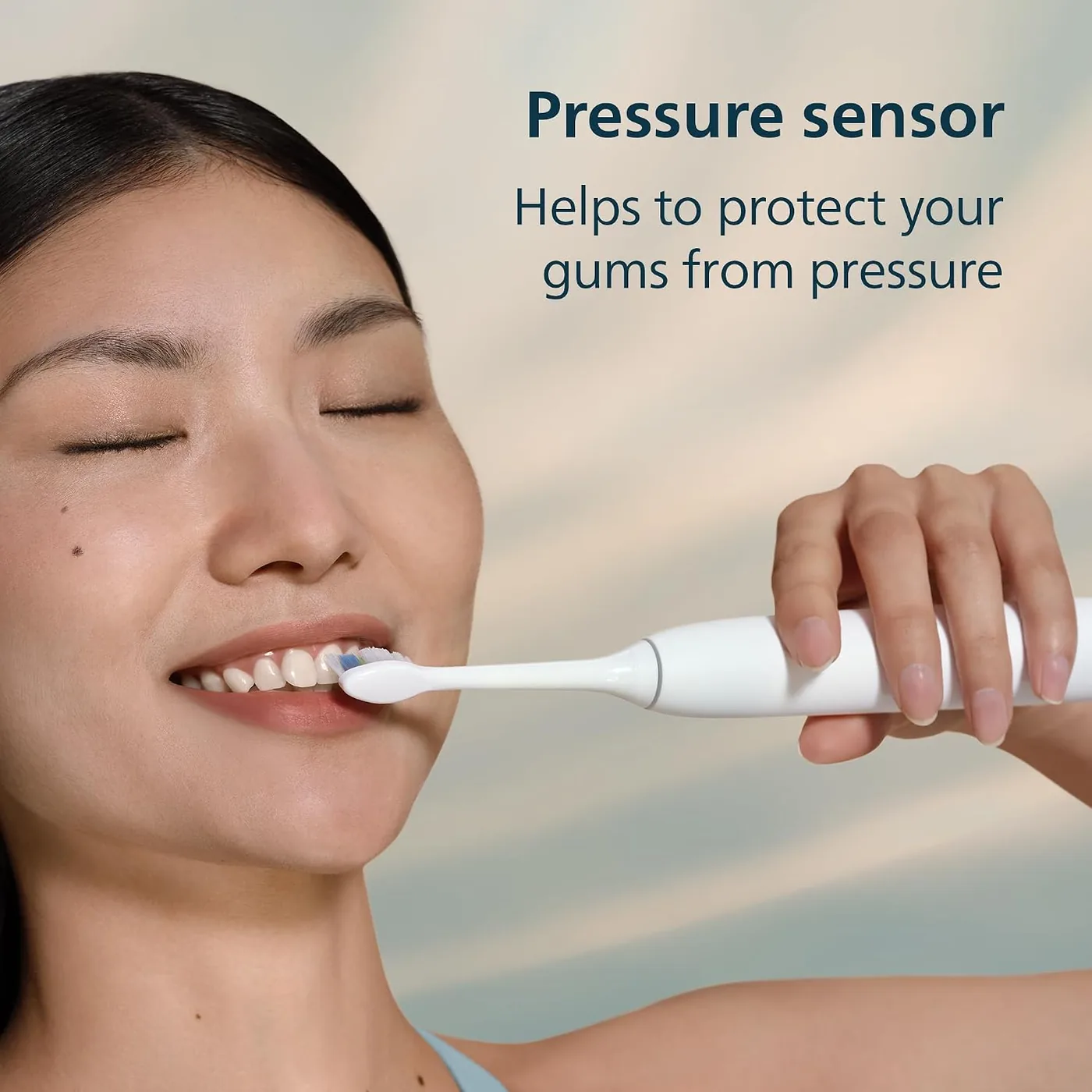 Person using the Philips Sonicare 5300 with the pressure alert shown in the manufacturer graphic
