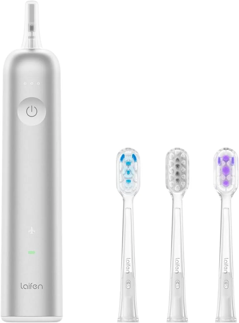 Laifen Wave electric toothbrush in aluminium alloy with three replacement brush heads beside it