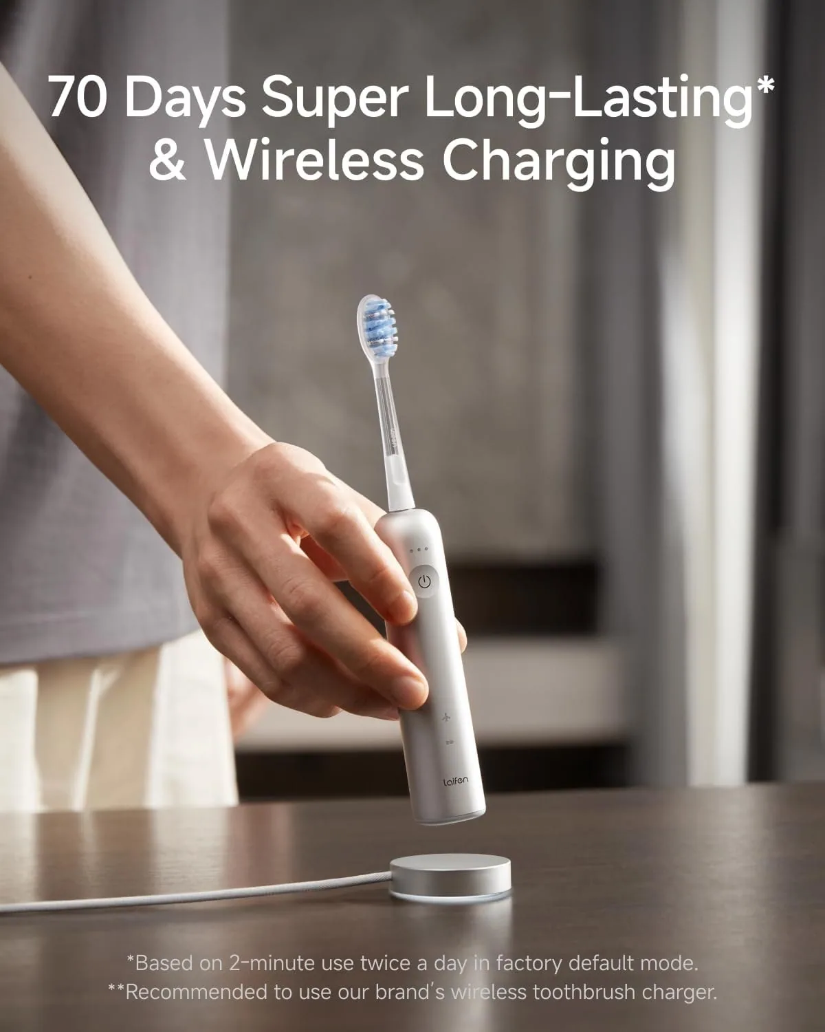 A hand placing the Laifen Wave Pro on its round charging dock, labelled by the manufacturer as a 70-day battery