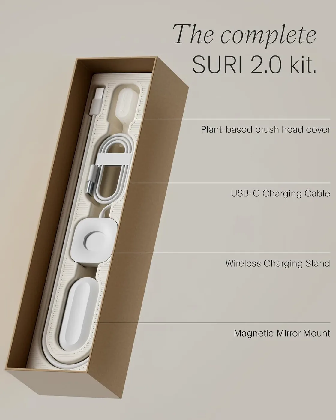 The SURI Pro 2.0 kit laid out showing the brush, plant-based head cover, USB-C cable, wireless charging stand and magnetic mirror mount